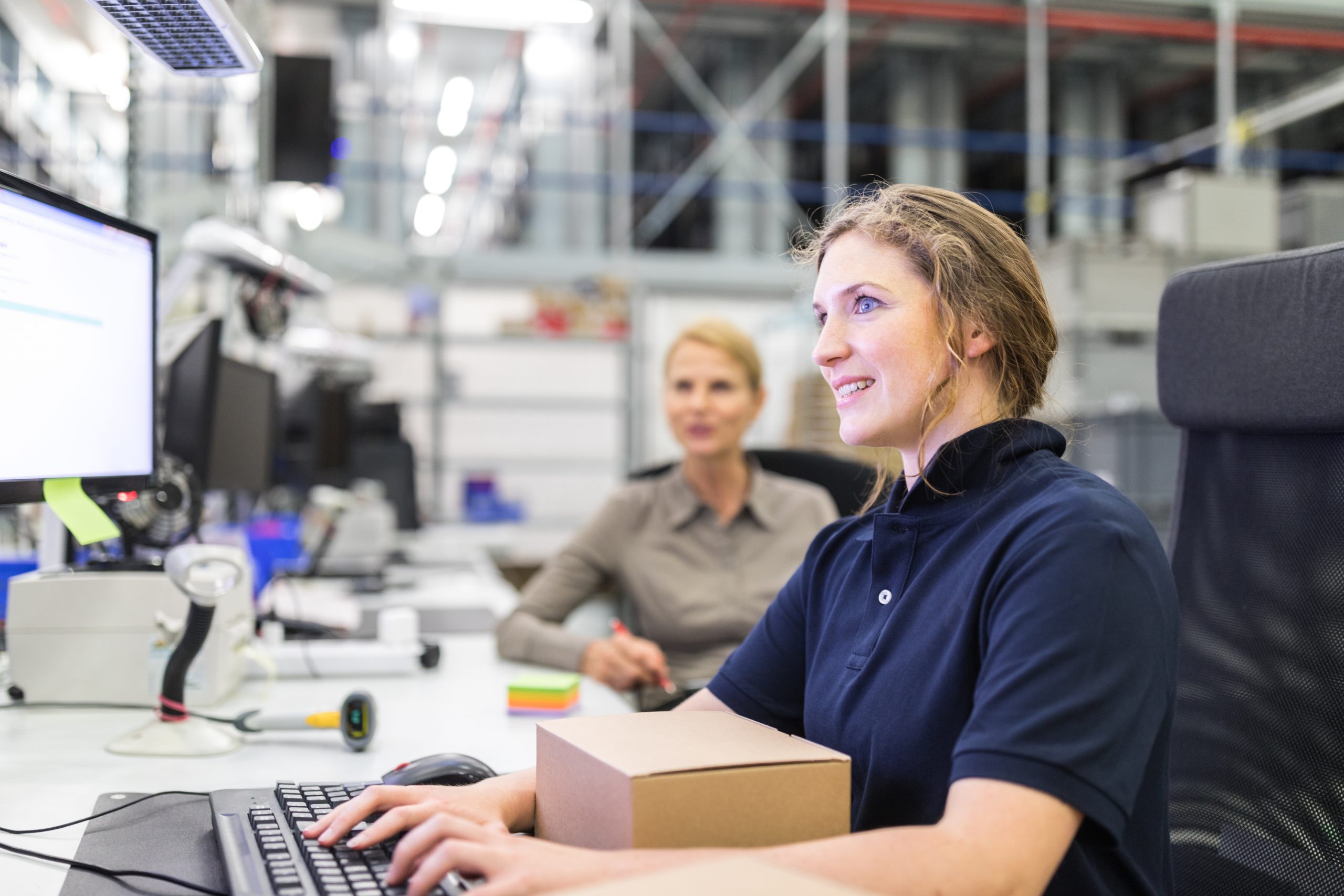 Worker preparing a package to dispatch